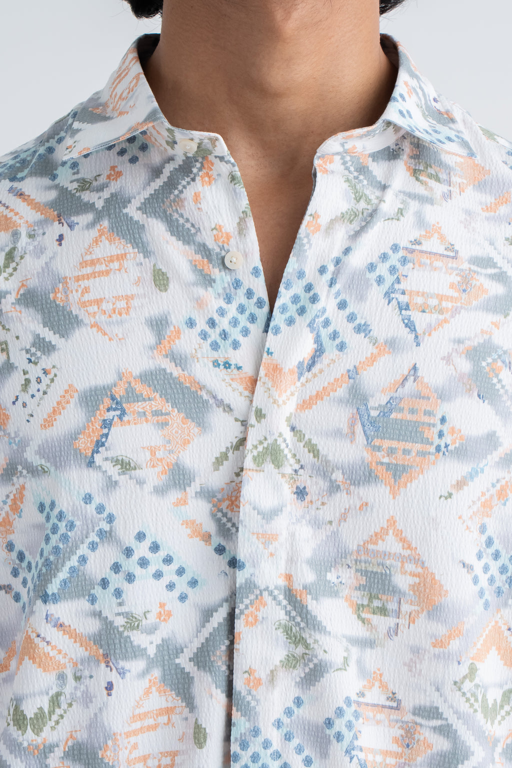patterned shirt with geometric  designs.